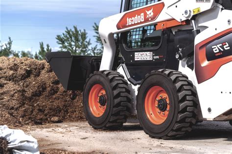 tracks vs wheels skid steer|skid steer tires clearance.